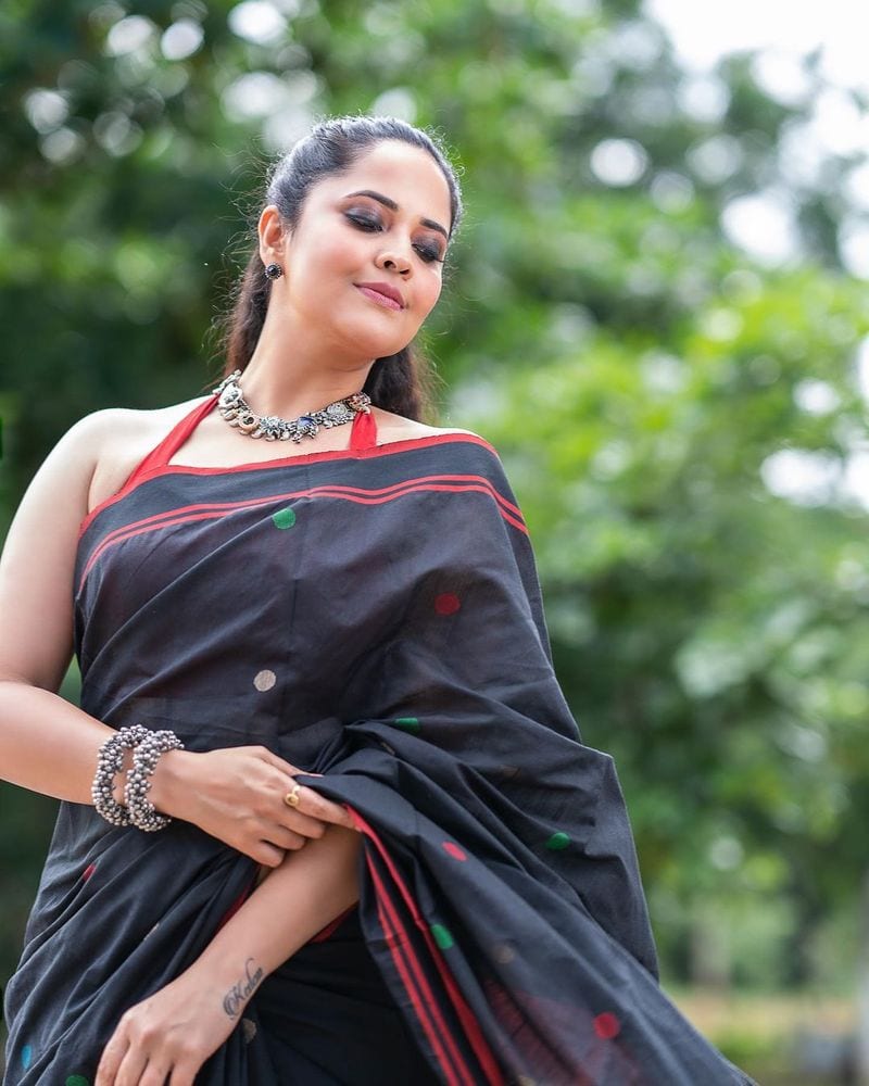 hot anchor anasuya fire on internet with her backless black saree photos trending