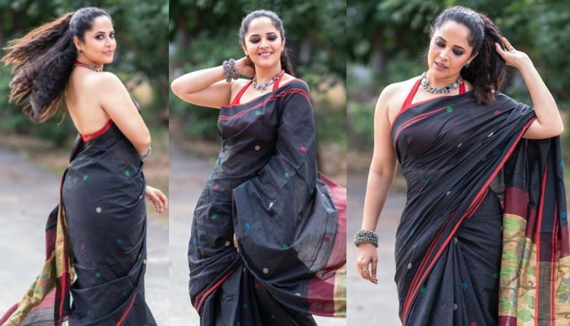 hot anchor anasuya fire on internet with her backless black saree photos trending