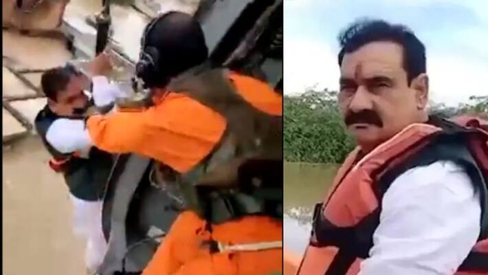 Minister arrives to rescue flood victims And finally a helicopter to rescue the minister Minister arrives to rescue flood victims And finally a helicopter to rescue the minister