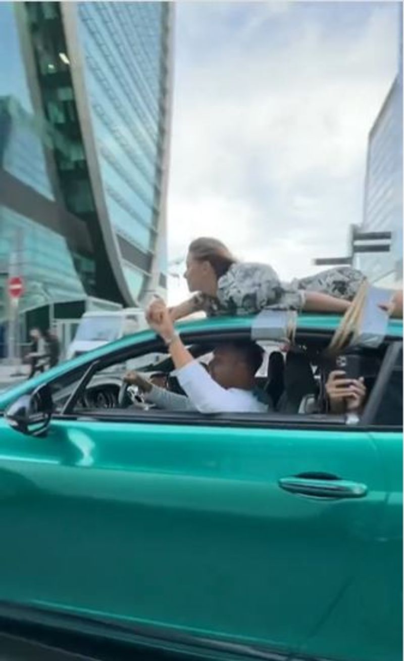 Man Drives With Girlfriend Tied To Roof In Bizarre 'Trust Test' In Russia