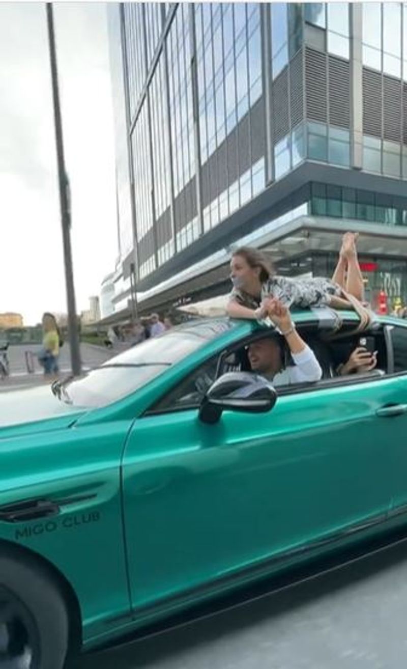 Man Drives With Girlfriend Tied To Roof In Bizarre 'Trust Test' In Russia