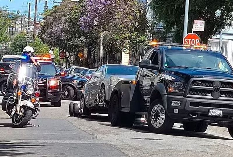 San Francisco, viral picture of woman with AK 47 in hand with speeding car