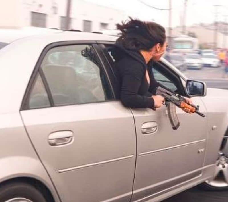 San Francisco, viral picture of woman with AK 47 in hand with speeding car