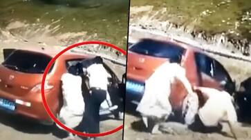 Terrifying moment: Family bounce out of the car, goes down the cliff - gps Terrifying moment: Family bounce out of the car, goes down the cliff - gps