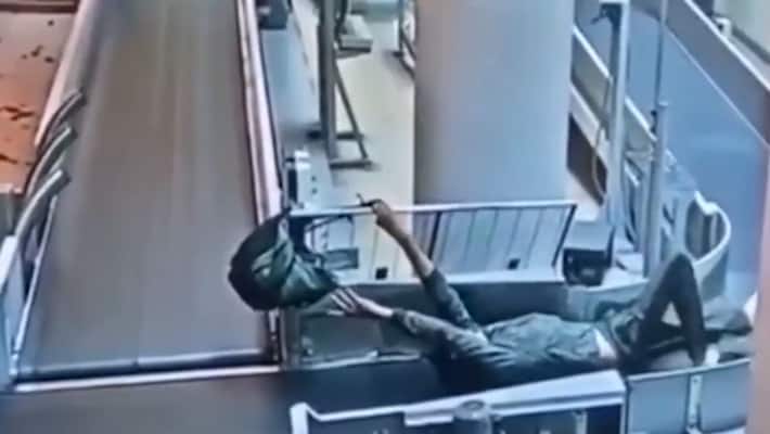 Russia Drunk man walks into airport's luggage carousel network; watch video to know what happens next-tgy Russia Drunk man walks into airport's luggage carousel network; watch video to know what happens next-tgy