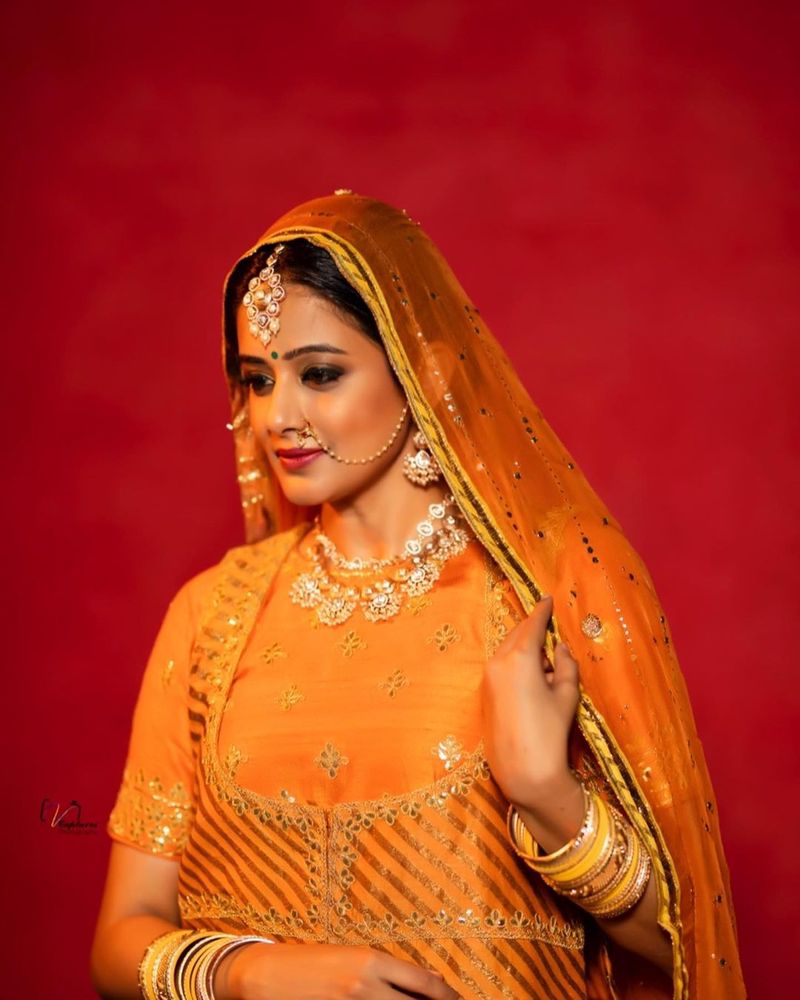 dhee fame priyamani ready to like princess mitrvinda orange lehanga photos viral