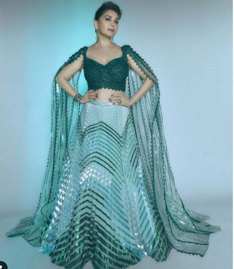 Madhuri Dixit in 2 lakh futuristic traditional lehenga can get you 2 Apple Macbook dpl