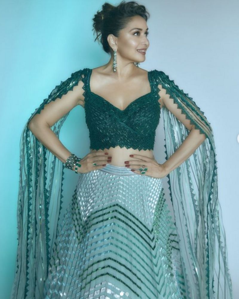 Madhuri Dixit in 2 lakh futuristic traditional lehenga can get you 2 Apple Macbook dpl