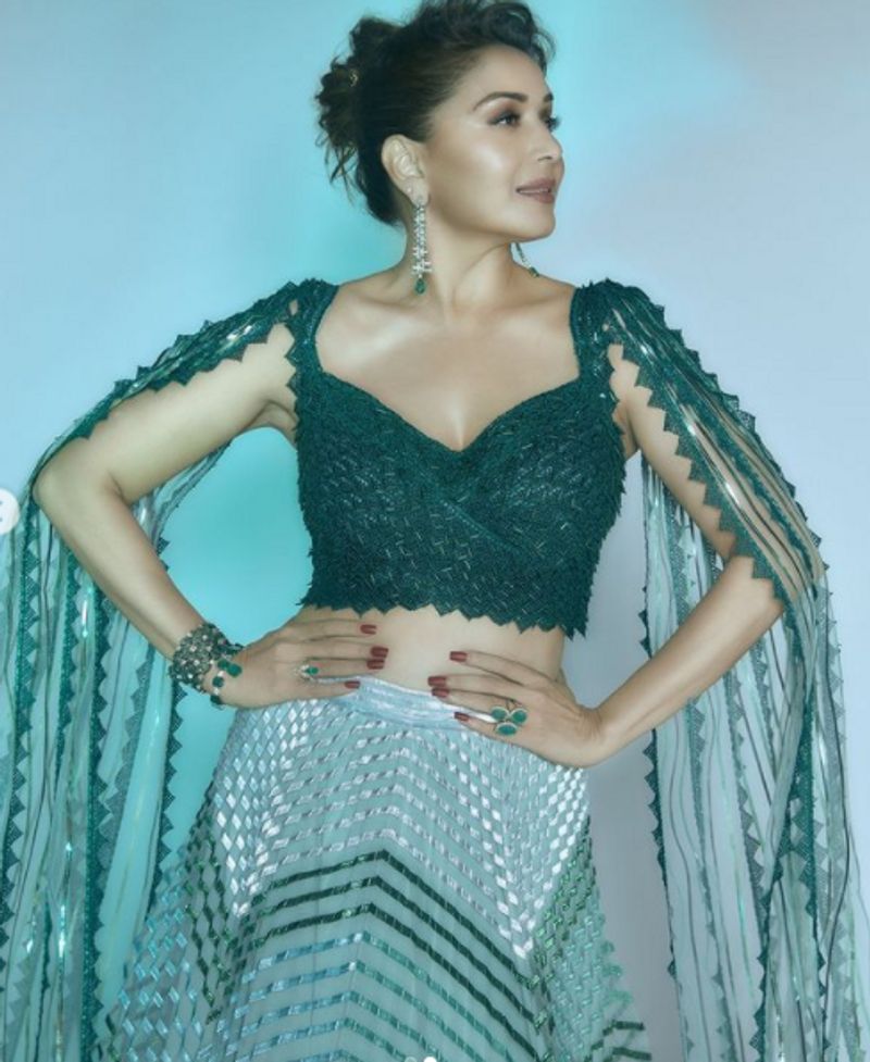 Madhuri Dixit in 2 lakh futuristic traditional lehenga can get you 2 Apple Macbook dpl