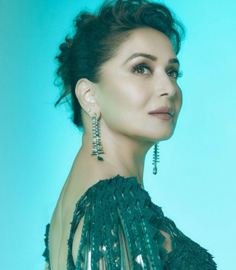 Madhuri Dixit in 2 lakh futuristic traditional lehenga can get you 2 Apple Macbook dpl