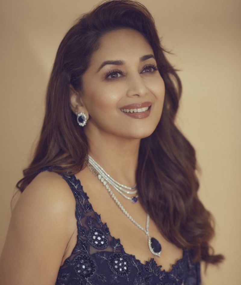 Madhuri Dixit in 2 lakh futuristic traditional lehenga can get you 2 Apple Macbook dpl