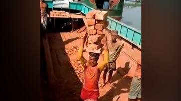 Watch Man balancing pile of bricks on head goes viral; Anand Mahindra praises his unique skills-tgy Watch Man balancing pile of bricks on head goes viral; Anand Mahindra praises his unique skills-tgy