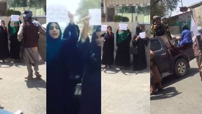 women holding handwritten paper signs stand surrounded by armed Taliban fighters first protest after taliban takes over kabul women holding handwritten paper signs stand surrounded by armed Taliban fighters first protest after taliban takes over kabul