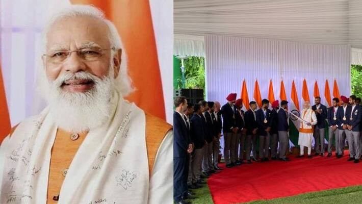 PM Modi Wears gumcha Autographed By Indian Olympians PM Modi Wears gumcha Autographed By Indian Olympians