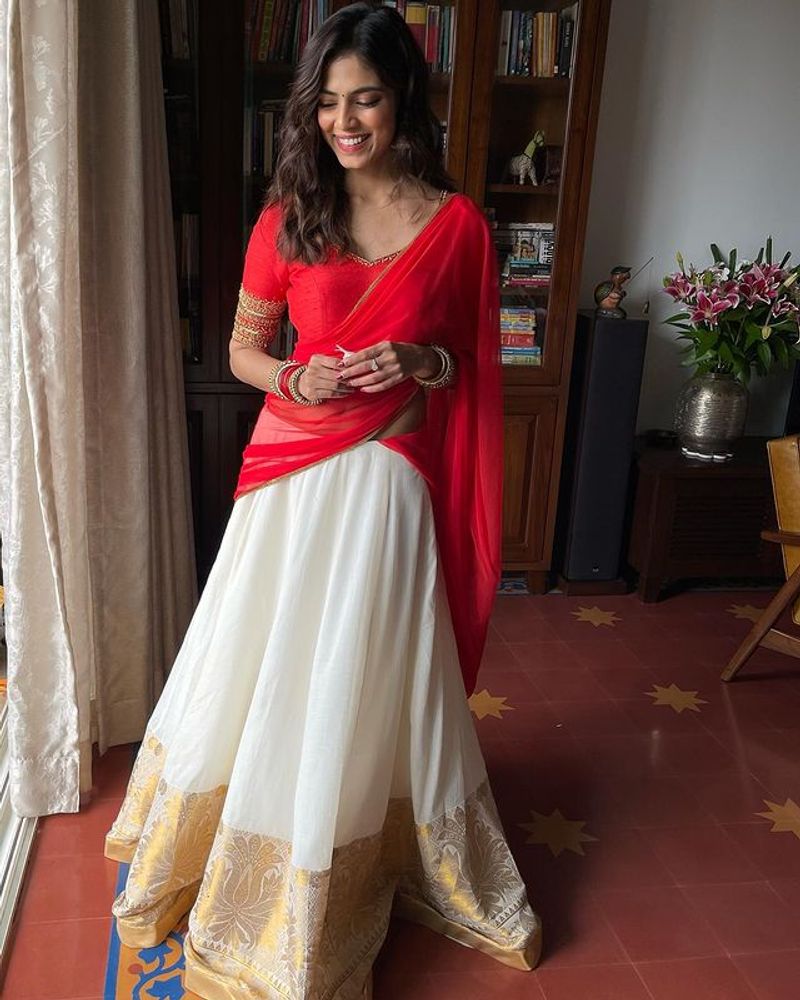 malavika mohan red half saree stunning photos