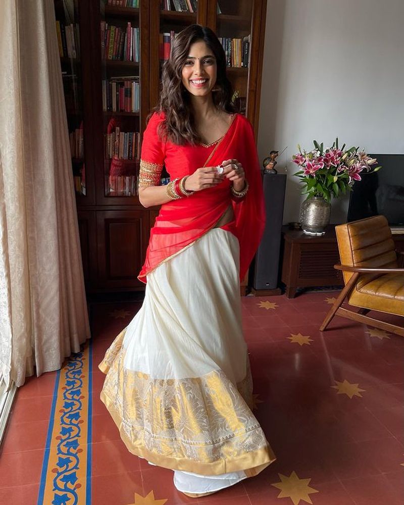 malavika mohan red half saree stunning photos