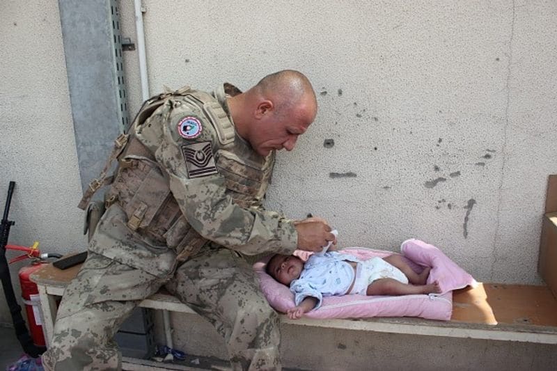 Afghanistan Soldiers helping rescue Afghan civilians at Kabul Airport