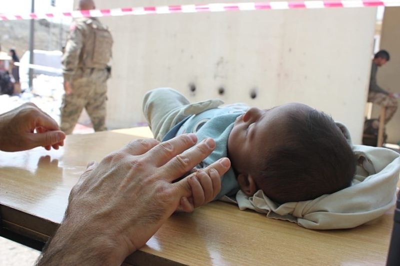 Afghanistan Soldiers helping rescue Afghan civilians at Kabul Airport