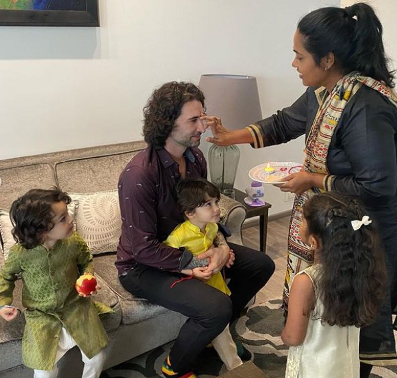 Sunny Leone daughter Nisha tie rakhis on their security in charge Yusuf Ibrahim dpl