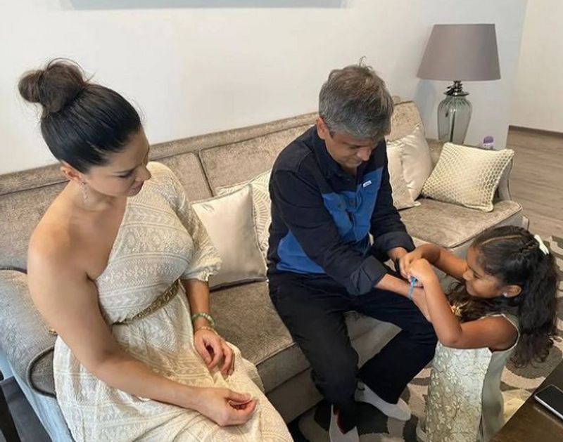 Sunny Leone daughter Nisha tie rakhis on their security in charge Yusuf Ibrahim dpl
