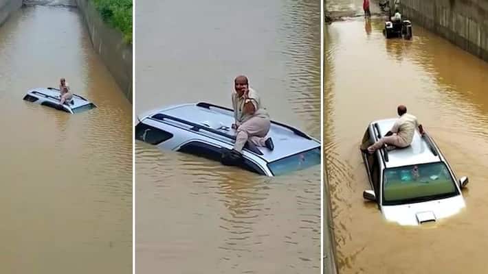 Toyota Fortuner rescued by a tractor when it stuck in a flooded underpass Toyota Fortuner rescued by a tractor when it stuck in a flooded underpass