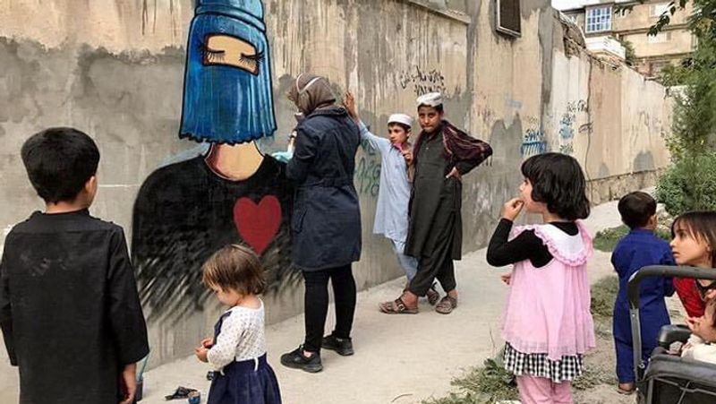 Emotional photos of Graffiti Artist Shamsia Hassani related to women, children and human rights in Afghanistan