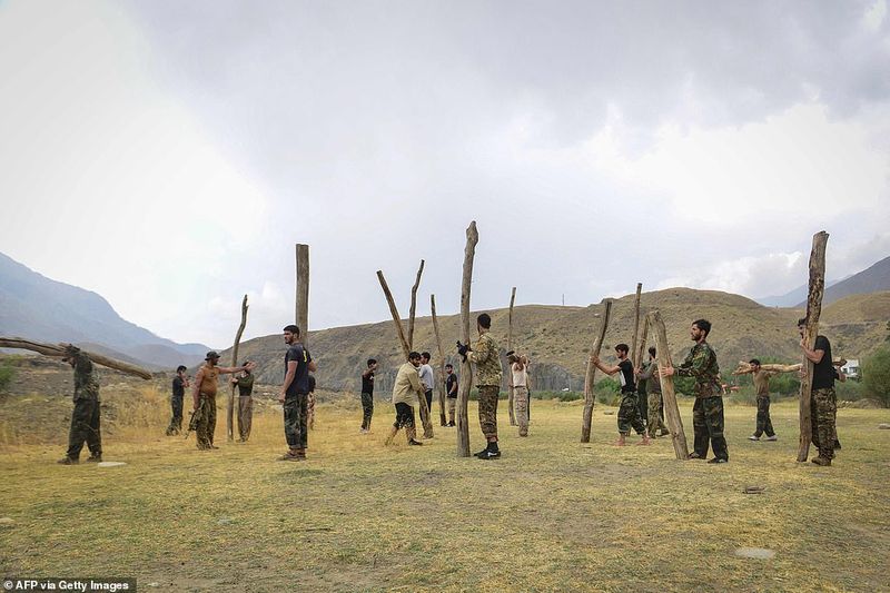 northern alliance forces train in the Afghan mountains agianst taliban