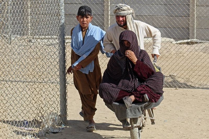 Taliban claim Afghan independence thousands of Afghans flee their homeland