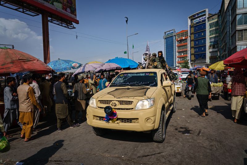 taliban parade to show off captured weapons as Afghanistan leads to humanitarian crisis