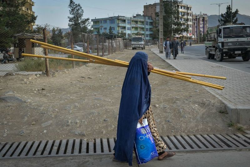 taliban parade to show off captured weapons as Afghanistan leads to humanitarian crisis