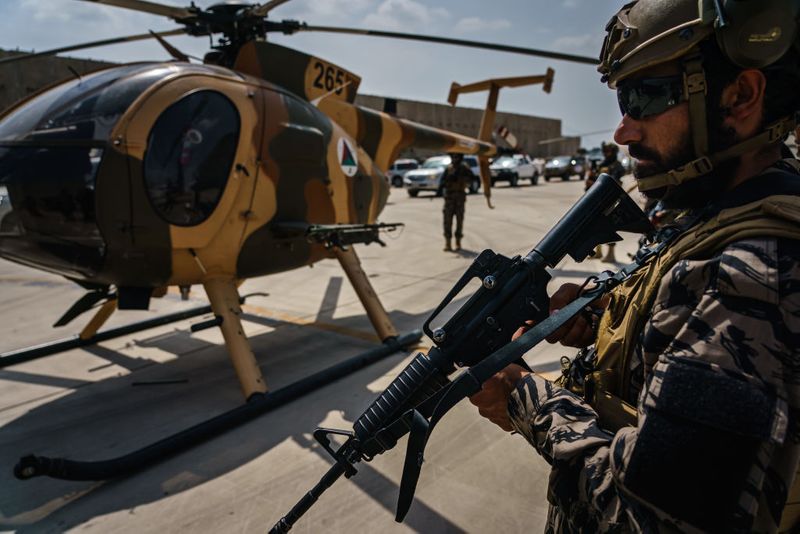 taliban parade to show off captured weapons as Afghanistan leads to humanitarian crisis