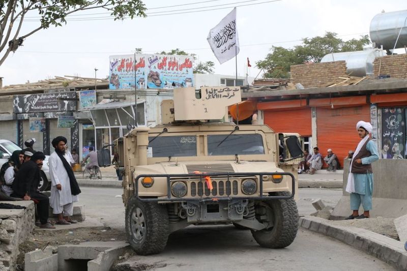 taliban parade to show off captured weapons as Afghanistan leads to humanitarian crisis