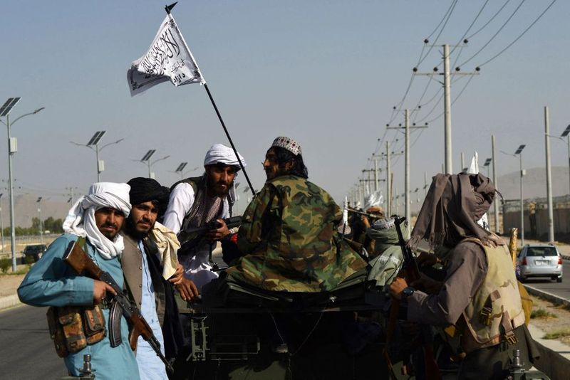 taliban parade to show off captured weapons as Afghanistan leads to humanitarian crisis