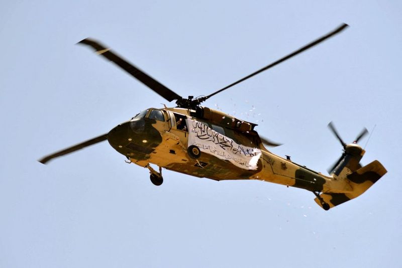 taliban parade to show off captured weapons as Afghanistan leads to humanitarian crisis