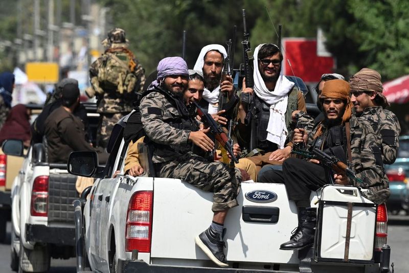 taliban parade to show off captured weapons as Afghanistan leads to humanitarian crisis