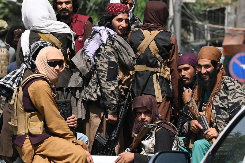 taliban parade to show off captured weapons as Afghanistan leads to humanitarian crisis