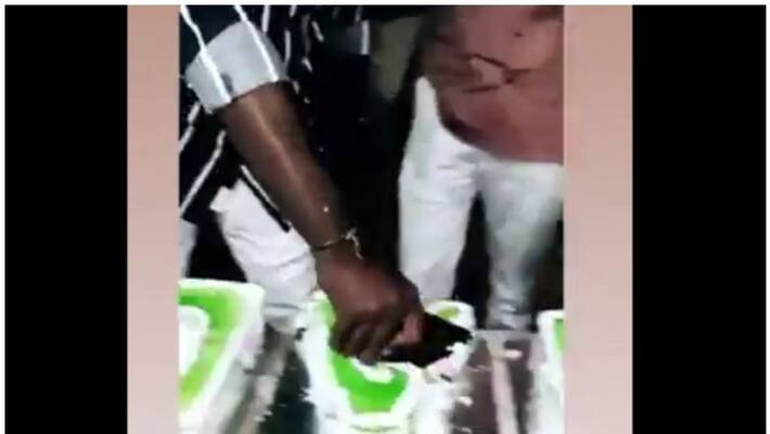 karnataka bjp mla basavaraj dhadesugur son cuts birthday cake with iphone evokes controversy in the state politics karnataka bjp mla basavaraj dhadesugur son cuts birthday cake with iphone evokes controversy in the state politics
