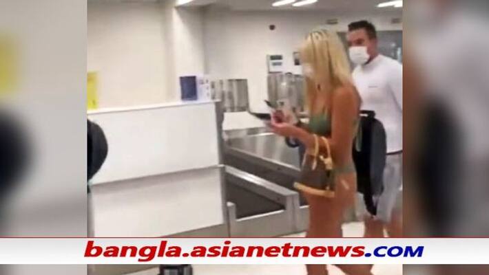USA Woman walks through airport in bikini and face mask, video goes viral ALB USA Woman walks through airport in bikini and face mask, video goes viral ALB