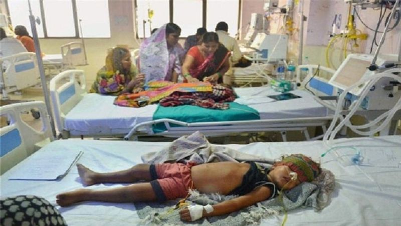 uttar pradesh mystery disease viral fever two children admitted to one bed in prayagraj hospital