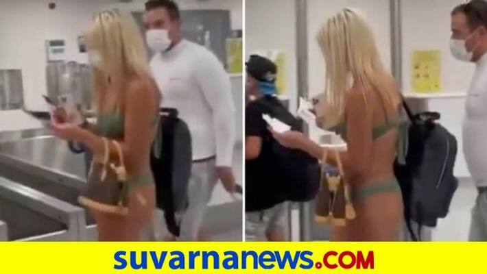 Woman walks into US airport wearing just a bikini and face mask Viral video mah Woman walks into US airport wearing just a bikini and face mask Viral video mah