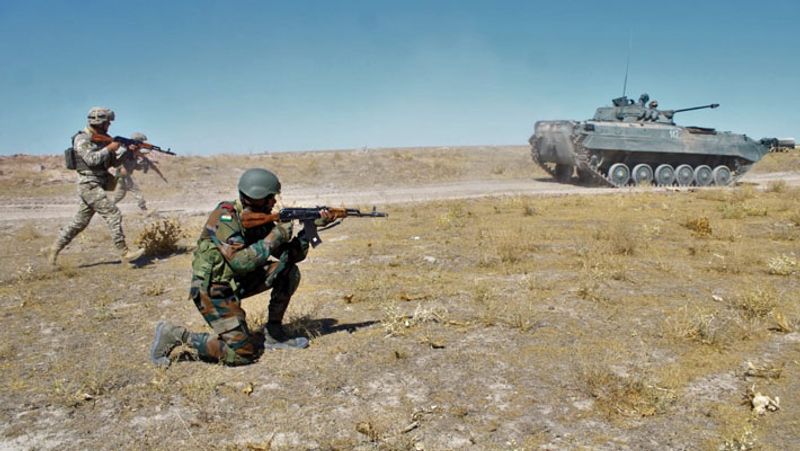 Troops of India and Kazakhstan carrying out the demonstration of a raid on a terrorist hideout during the joint military exercise