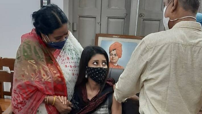 Bizarre images of MLA Lovely Maitra-s vaccination by doctor Pallab Das has created a spark on the internet Bizarre images of MLA Lovely Maitra-s vaccination by doctor Pallab Das has created a spark on the internet