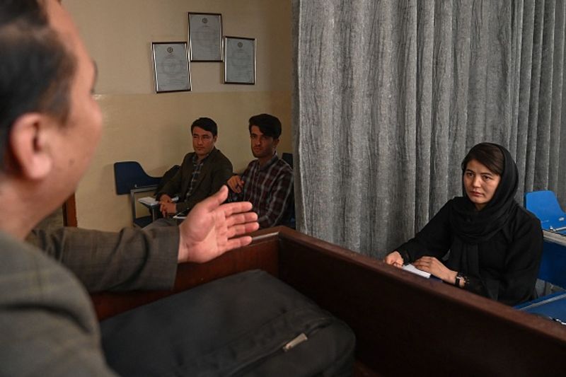 Private universities open in Afghanistan Curtain separating boys and girls in classroom