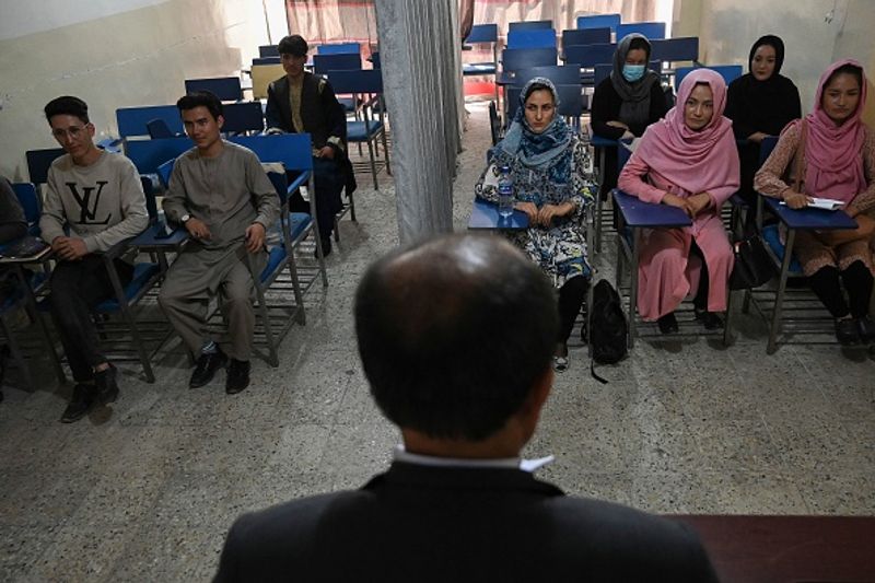 Private universities open in Afghanistan Curtain separating boys and girls in classroom