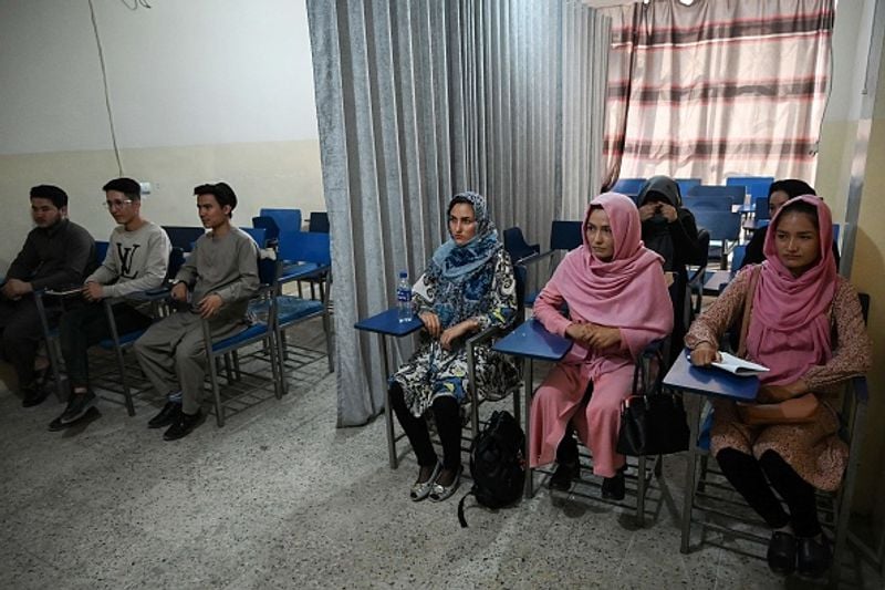Private universities open in Afghanistan Curtain separating boys and girls in classroom