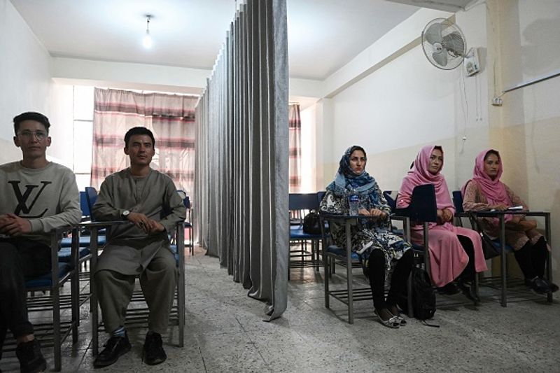 Private universities open in Afghanistan Curtain separating boys and girls in classroom