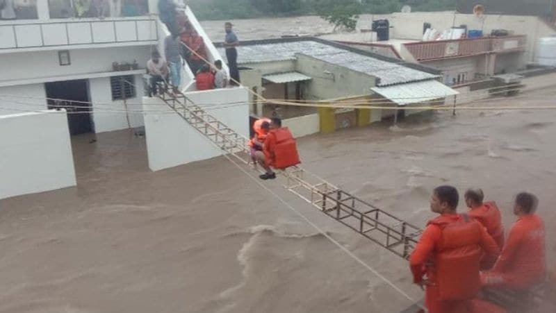gujarat flood and heavy rainfall drowned in jamnagar rajkot rescue operation