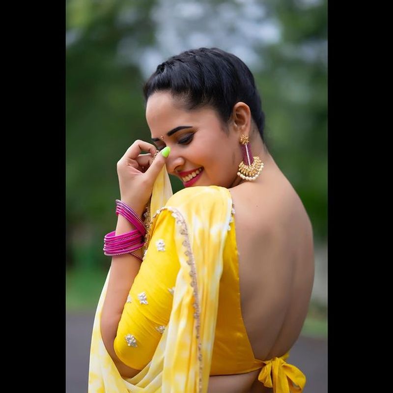 Tollywood Anchor Anasuya hot look in yellow half saree