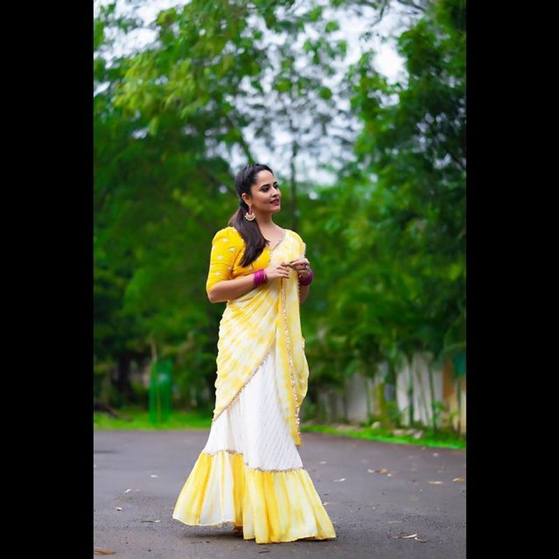 Tollywood Anchor Anasuya hot look in yellow half saree