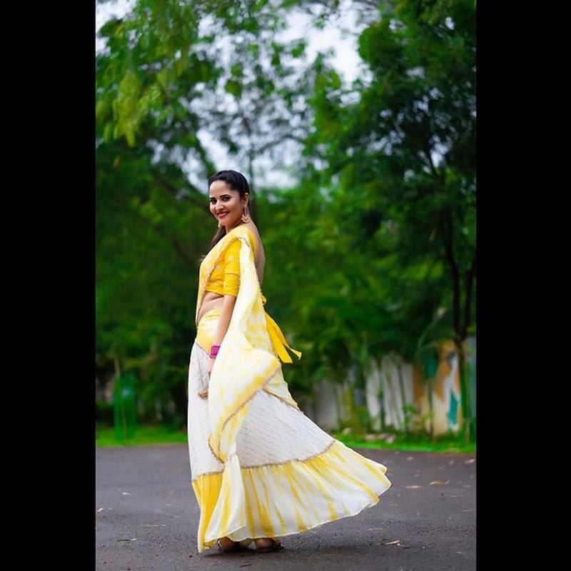 Tollywood Anchor Anasuya hot look in yellow half saree